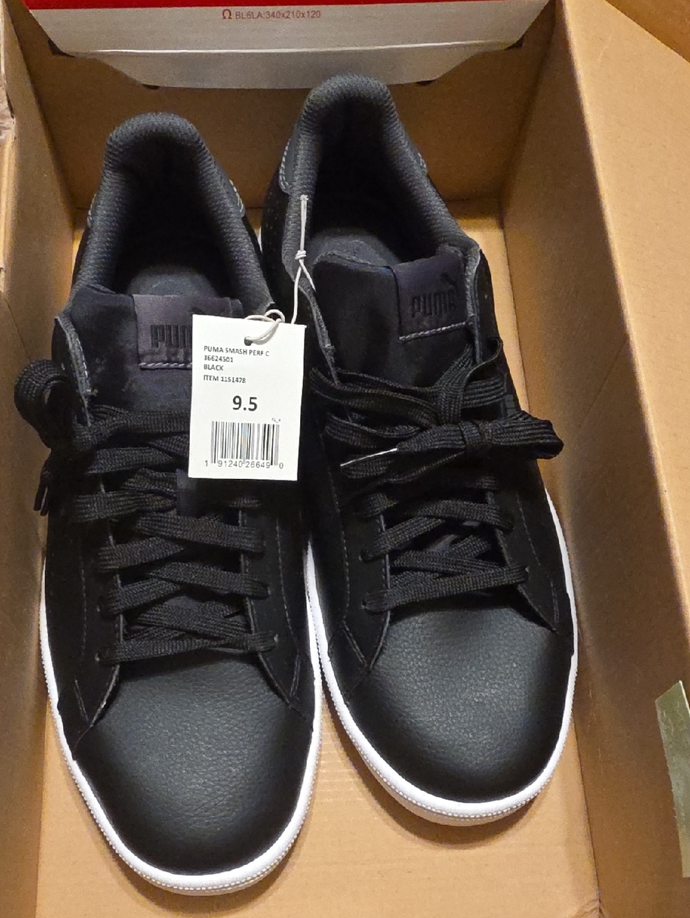 PUMA Men's Smash Perforated C sneakers in black with a white outsole.
